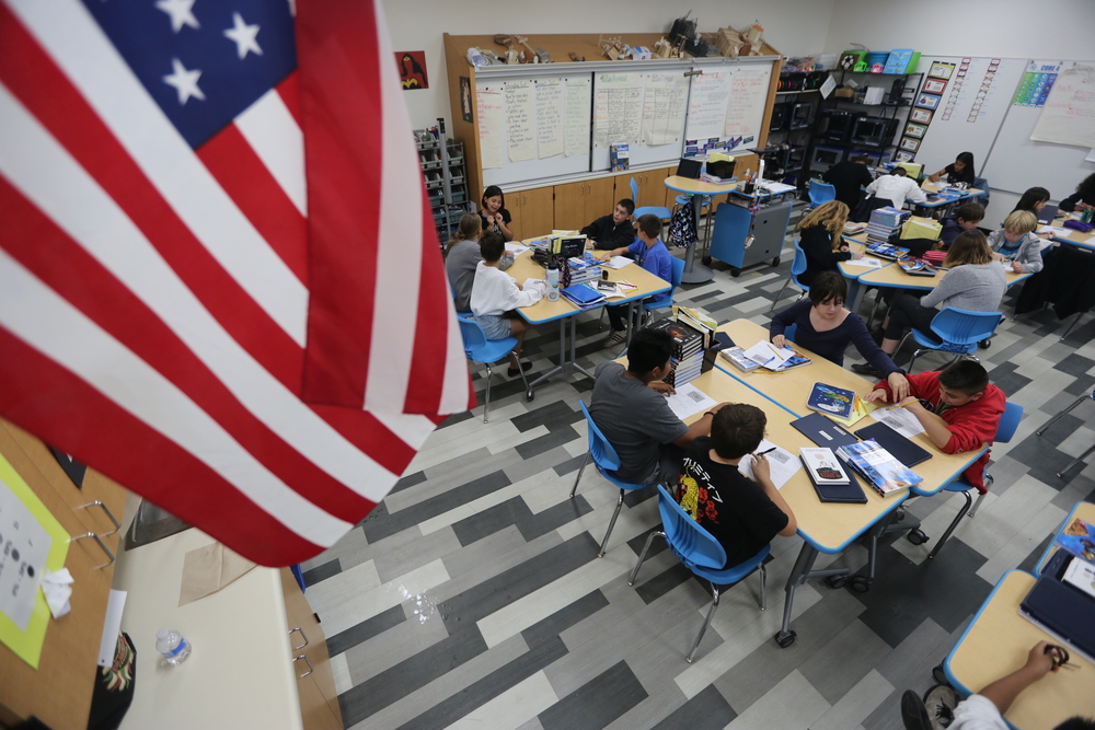 top view of classroom with flag and students at tables