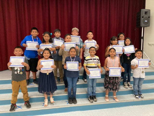 Reclassified Students holding their certificates from the 2022 Celebration