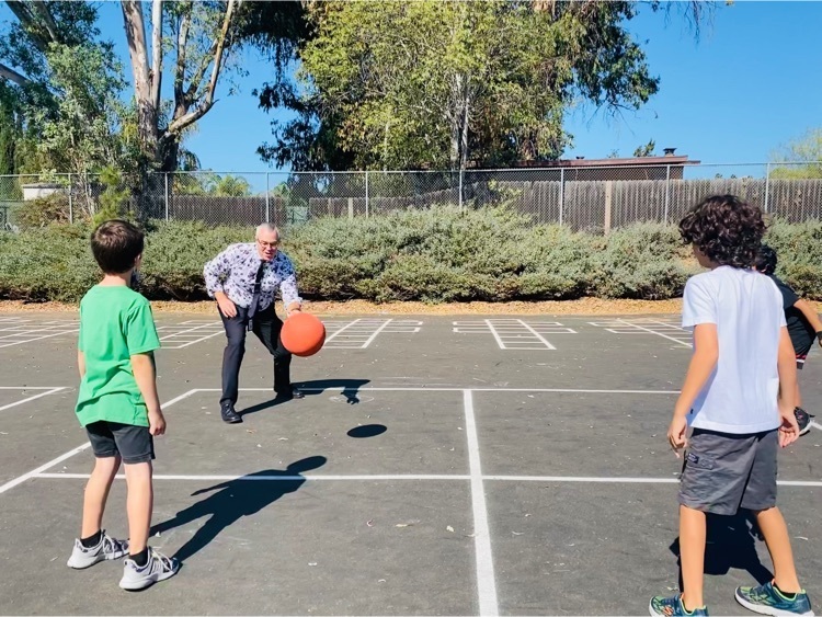 Assistant Superintendent Dr. John Albert playing four square with Reidy Creek Students.