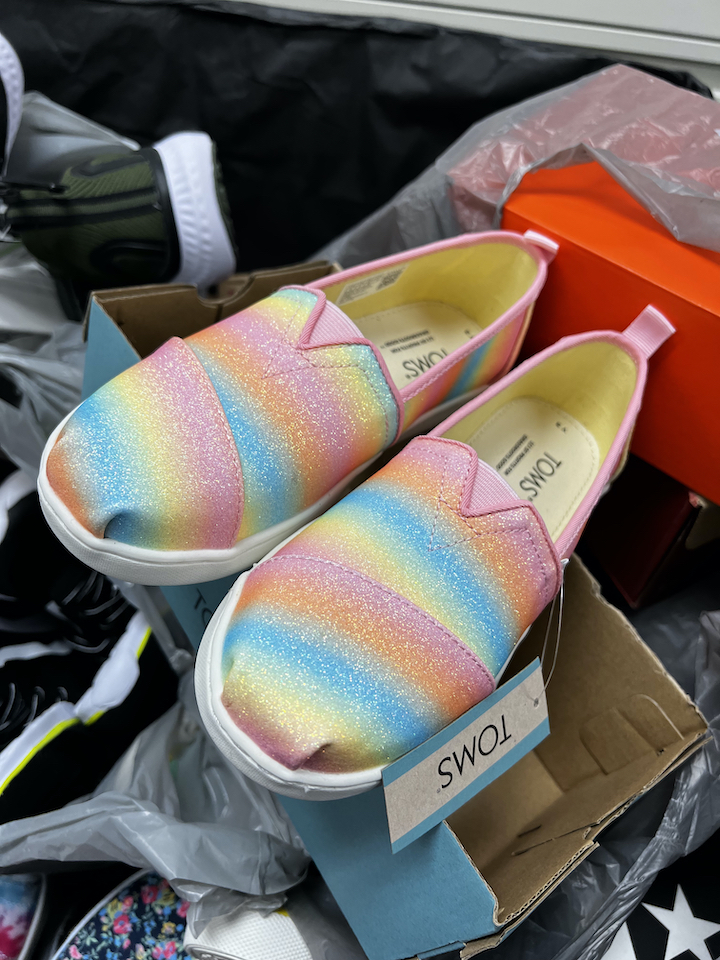 Close-up photo of new sparkle rainbow slip-on shoes
