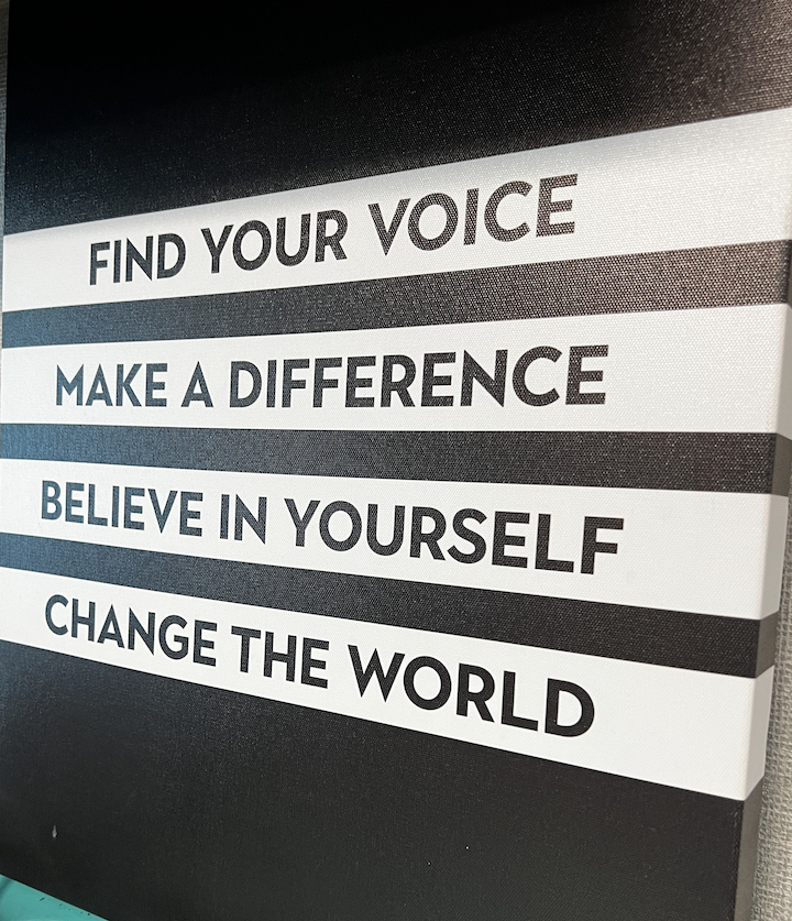 classroom sign says Find Your Voice, Make a Difference, Believe in Yourself, Change the World