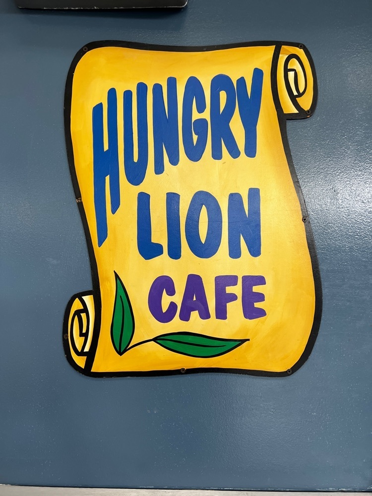 sign says Hungry Lion Cafe